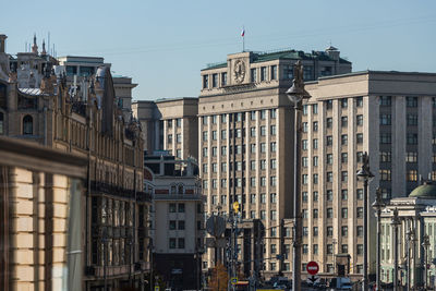 Buildings against clear sky in city