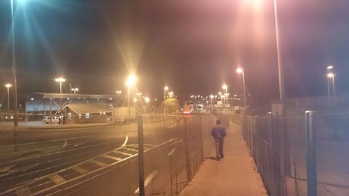 Illuminated street light at night