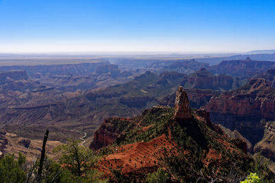 Aerial view of landscape with mountain range in background