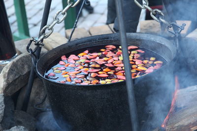 Close-up of boiling water in container outdoors