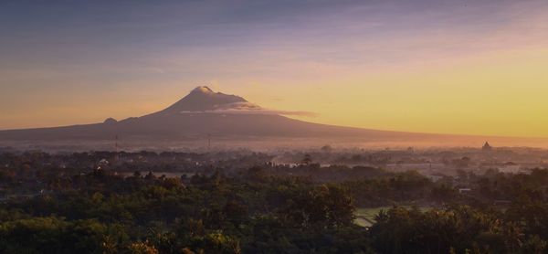 Scenic view of landscape against sky during sunset