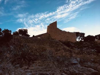 Low angle view of old building against sky