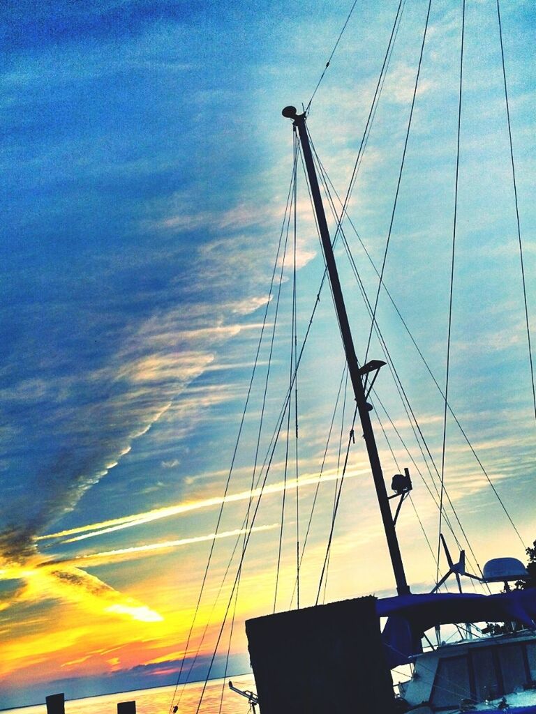 sky, low angle view, transportation, sunset, cloud - sky, mode of transport, blue, nautical vessel, cloud, power line, mast, built structure, silhouette, outdoors, no people, electricity pylon, electricity, connection, sunlight, architecture