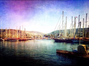 Boats moored at harbor