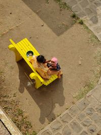 High angle view of people on yellow outdoors