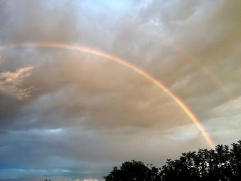 Low angle view of rainbow against sky