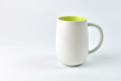 Close-up of coffee cup on white background