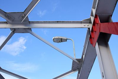 Low angle view of bridge against blue sky