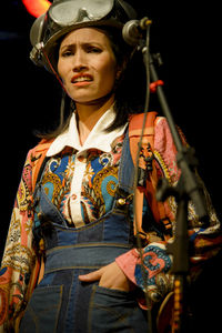 Actress representing a character on the stage of a theater. 