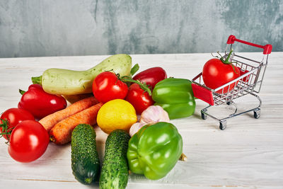 Close-up of tomatoes and fruits on table