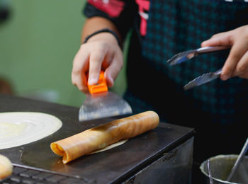 Close-up of person preparing food