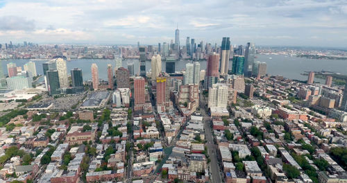 High angle view of modern buildings in city against sky