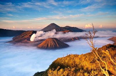 Scenic view of mountain against cloudy sky