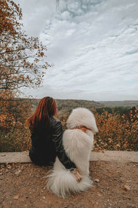 Dog on field against sky