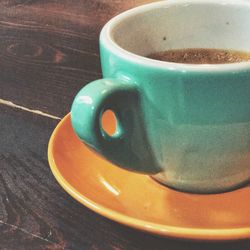 High angle view of coffee cup on table