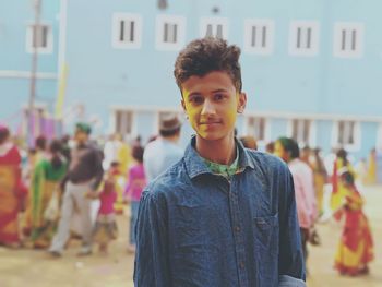 Portrait of smiling boy standing outdoors