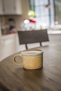 Close-up of coffee cup on table