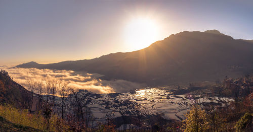 Scenic view of mountains against sky during sunset