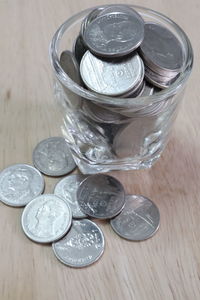 High angle view of coins on table