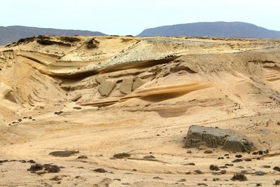 Scenic view of desert against clear sky