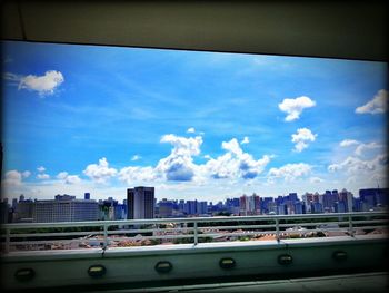 City street against cloudy sky