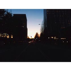 Road in city at sunset