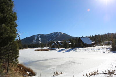 Scenic view of mountains against clear sky during winter