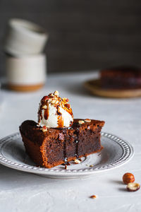 Chocolate cake with ice cream, nuts and chocolate sauce