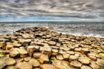 Scenic view of sea shore against sky