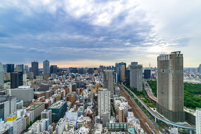 High angle view of buildings in city against sky