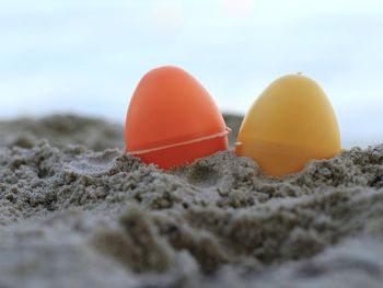 Close-up of multi colored umbrellas on beach