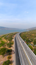 High angle view of road by sea against sky