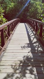 Footbridge against trees