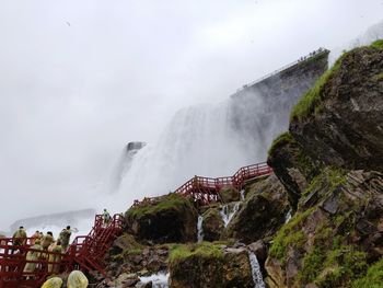 Panoramic view of waterfall against sky