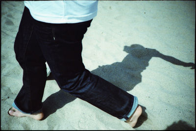 Low section of woman standing on tiled floor