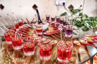 Close-up of wine glasses on table