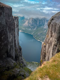Scenic view of sea and mountains against sky