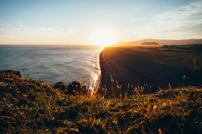 Scenic view of sea against sky during sunset