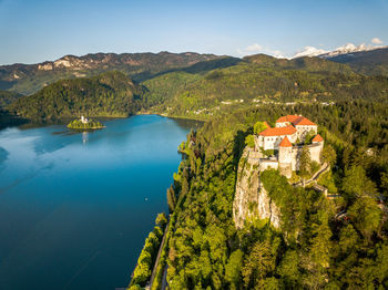 High angle view of lake and buildings against sky