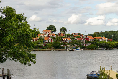 Houses in town against sky