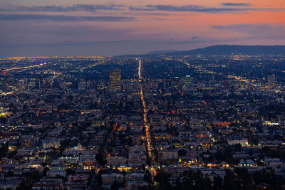 City against sky during sunset