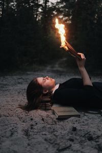 Midsection of woman holding bonfire