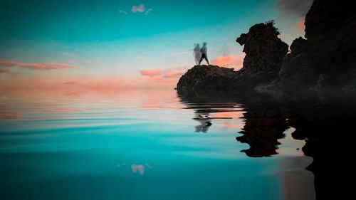 Reflection of rocks in sea