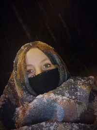 Portrait of a smiling young woman in snow