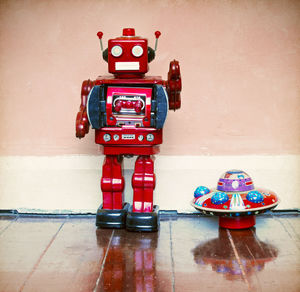 Close-up of toy car on table against wall