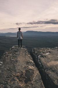 Woman stands at the balconies admiring the vast landscape, grampians national park, victoria, australia