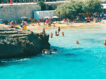 People enjoying in swimming pool