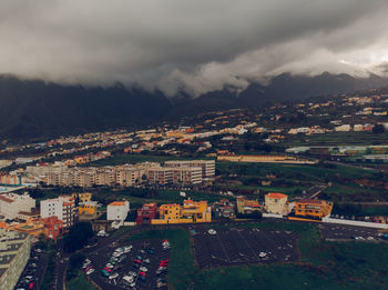 High angle view of buildings in city against sky