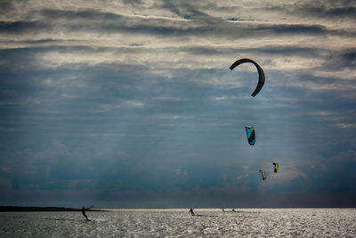 People paragliding in sky