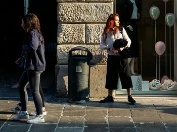 Woman standing on street